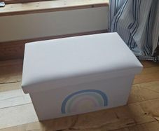 Storage box with a rainbow design
