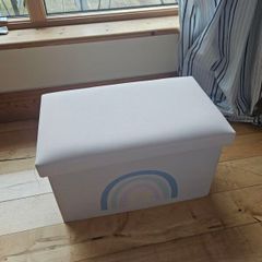 Storage box with a rainbow design