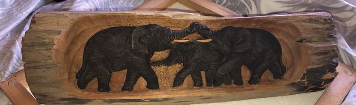 Hand carved wood.