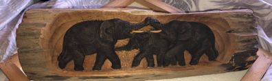 Hand carved wood.
