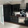 Black high gloss kitchen units and countertop Image 2