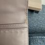 Guess purse. Never used. Slightly worn on inside due to storage. Image 5