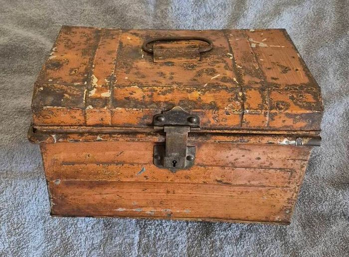 Small vintage metal trunk.