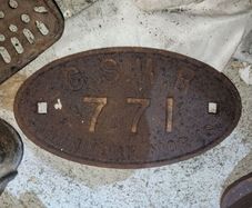 Railway carriage plate