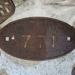 Railway carriage plate