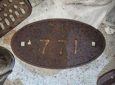 Railway carriage plate