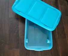 Blue underbed storage with castors