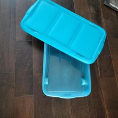 Blue underbed storage with castors