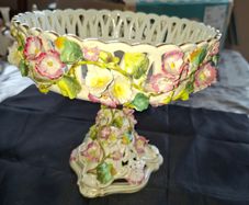 Antique German Porcelain Compote, likely from the Von Schierholz or Carl Thieme factory in Dresden, featuring hand-painted and encrusted floral decorations featuring intricate reticulated pierced basketwork and raised, hand applied flowers., postage avail