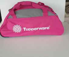 Tupperware pink roller bag