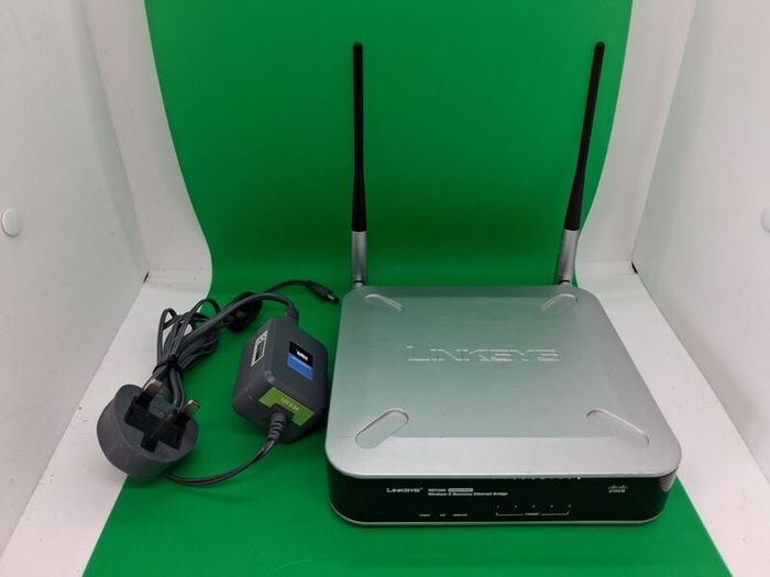 Postage - Linksys Cisco WET200 Wireless Ethernet Bridge Router.