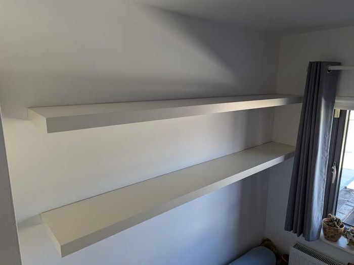 Two white floating shelves