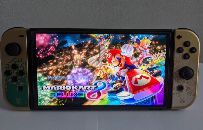 Zelda: Tears of the Kingdom OLED Nintendo Switch Console CIB + Official Breath of the Wild Switch Case + Mario Kart 8 Deluxe