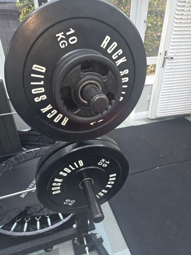Mint condition - amazing heavy duty black squat rack with almost brand new Rock Solid barbell and bumper plates - a must see!!!