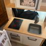 Child play house & kitchen ' but the play house does need a small bit put back on as  a pice came of it when I over lift it Image 2