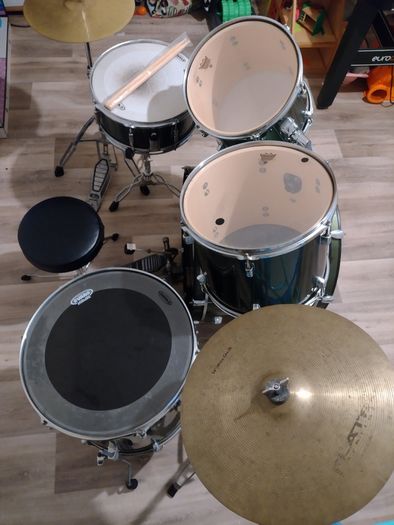 Pearl Drum Kit with professional drum heads.