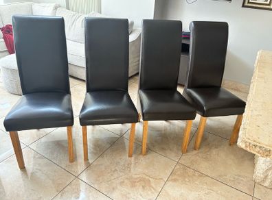 4 brown leather chairs