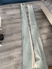 Teal coloured curtains 90x90 with islets to hang them from a pole.