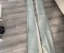 Teal coloured curtains 90x90 with islets to hang them from a pole.