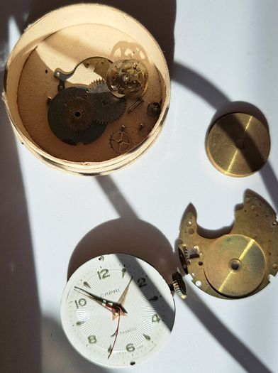 Lot of Antique Watch Parts in Containers