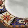 Antique small octagonal plate with floral pattern in blue, red and ochre tones Image 2