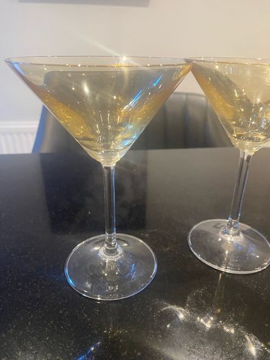 Set of four amber and plain glass martini or cocktail glasses