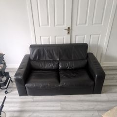 Free black two seater leather couch