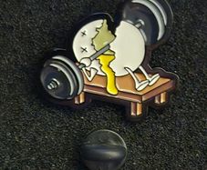 Weightlifting pin back badge.