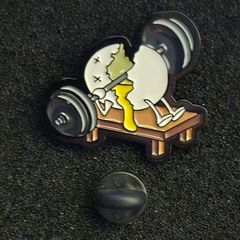 Weightlifting pin back badge.