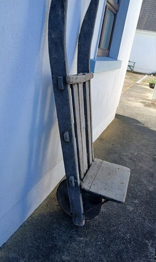 Antique peat wheelbarrow and peat spade