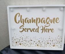 Lighting Up Champagne Sign