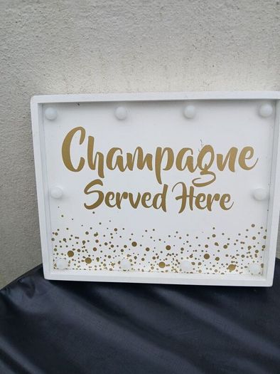 Lighting Up Champagne Sign