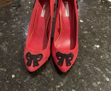 Red high heeled shoes with black lace