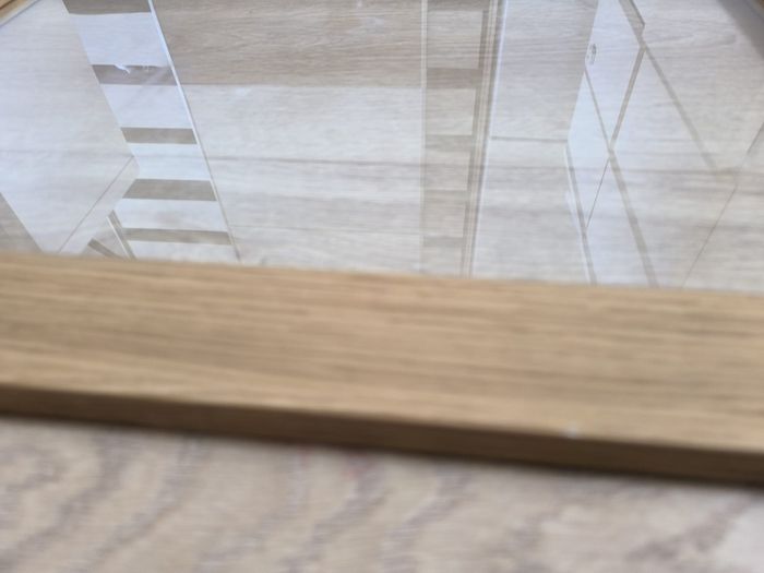 Original IKEA BESTA cabinet door/front panel in discontinued natural oak finish with clear glass centre.