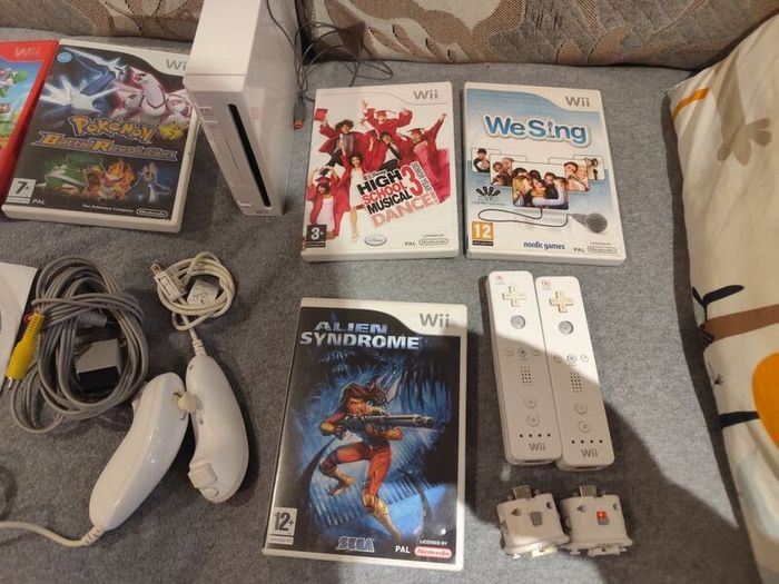 Wii Bundle with Pokemon, Mario Bros, Sports and Sports Resorts