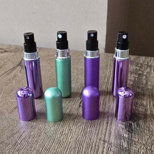 4 mini perfume spray bottles