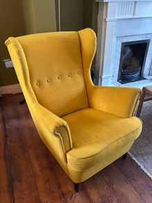 Yellow IKEA Strandmon wing chair