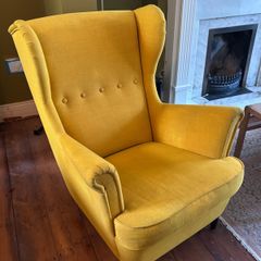 Yellow IKEA Strandmon wing chair
