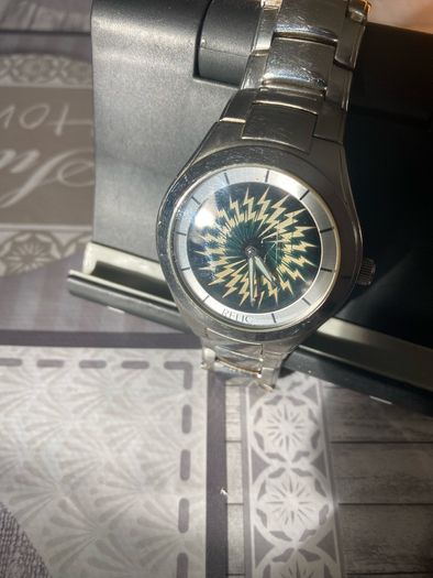 Relic face changing watch with broken watchstrap