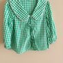 Marks and Spencers girls  green and white gingham shorts and tie-front top set. Image 2