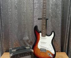 SX Stratocaster guitar and amp