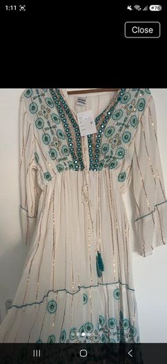 Stunning maxi dress  one size fits all .  new with tags  beautiful  on