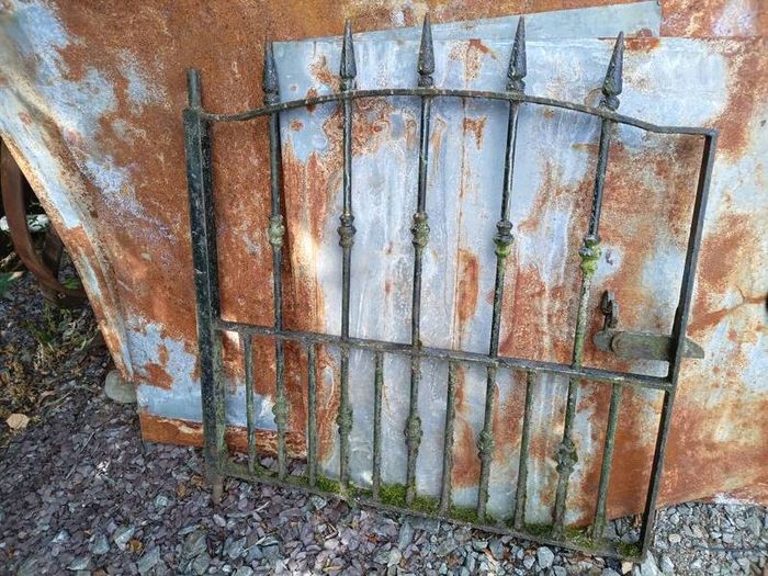 : Antique wrought iron garden gate.