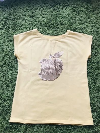 cute yellow t-shirt.  The "apple" has golden sequins