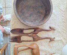 African wooden salad bowl and servers and antelope carving