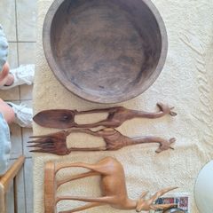 African wooden salad bowl and servers and antelope carving