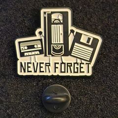 Never forget, retro audio,  pin back badge.