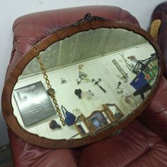 Antique oval mirror with original hanging chain