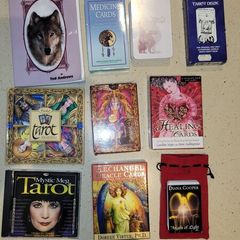 3 Tarot decks; 1 Medicine, 1 Animal, 1healing and 1 Angel cards, some with books and guides.