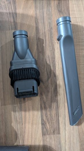 Dyson V6 handheld vacuum cleaner with charger and accessories